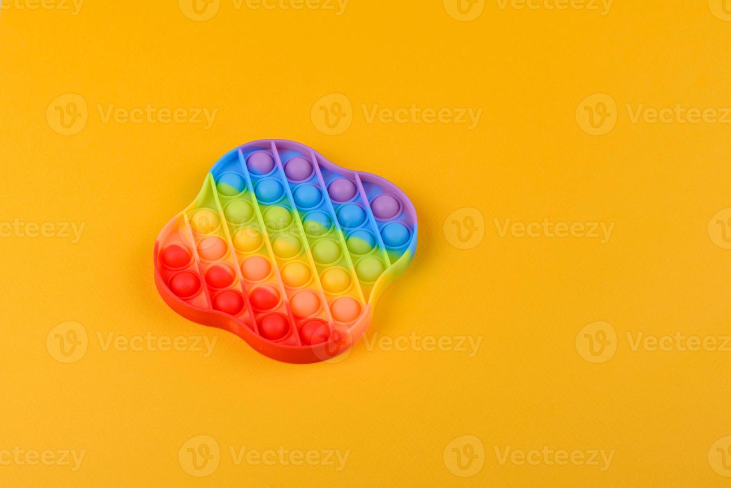Bright colorful children's toy made of silicone designed to relieve stress photo