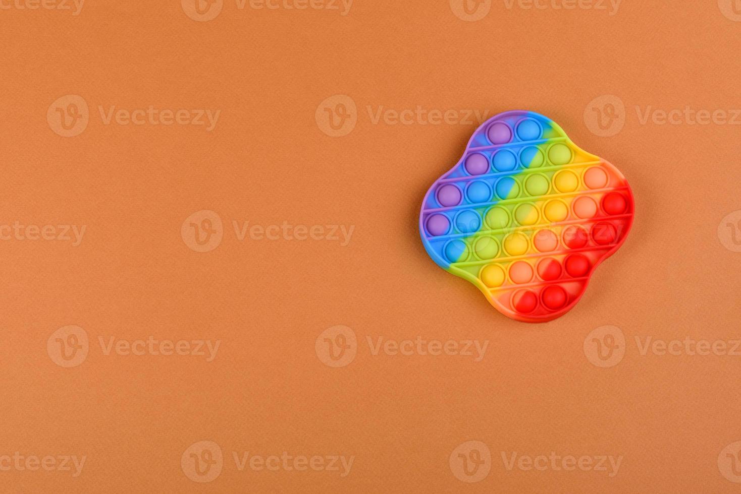 Bright colorful children's toy made of silicone designed to relieve stress photo