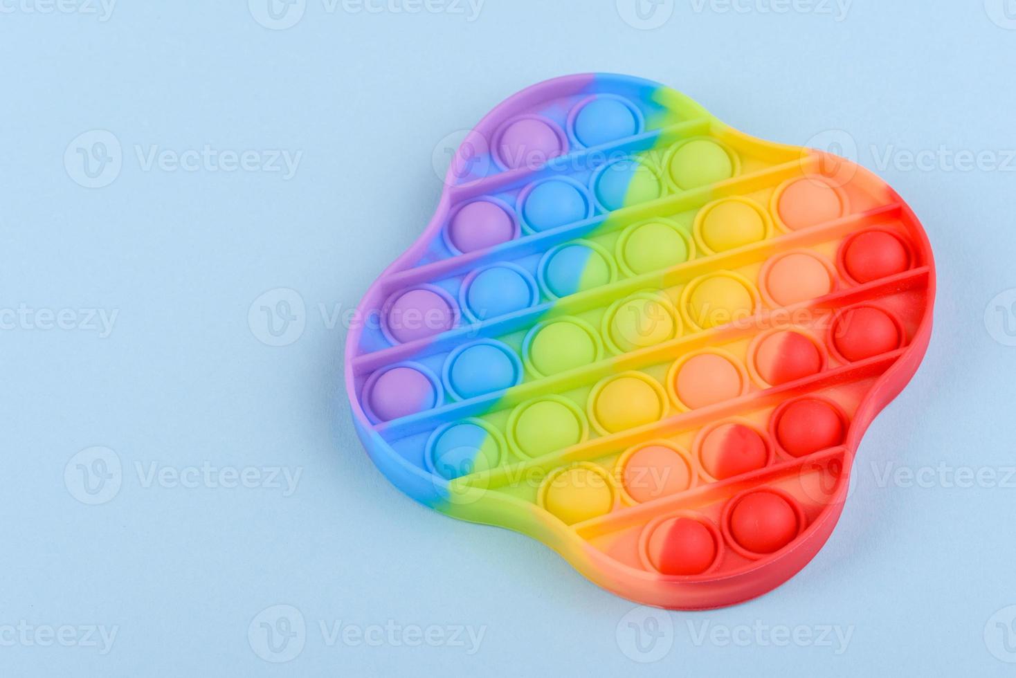 Bright colorful children's toy made of silicone designed to relieve stress photo