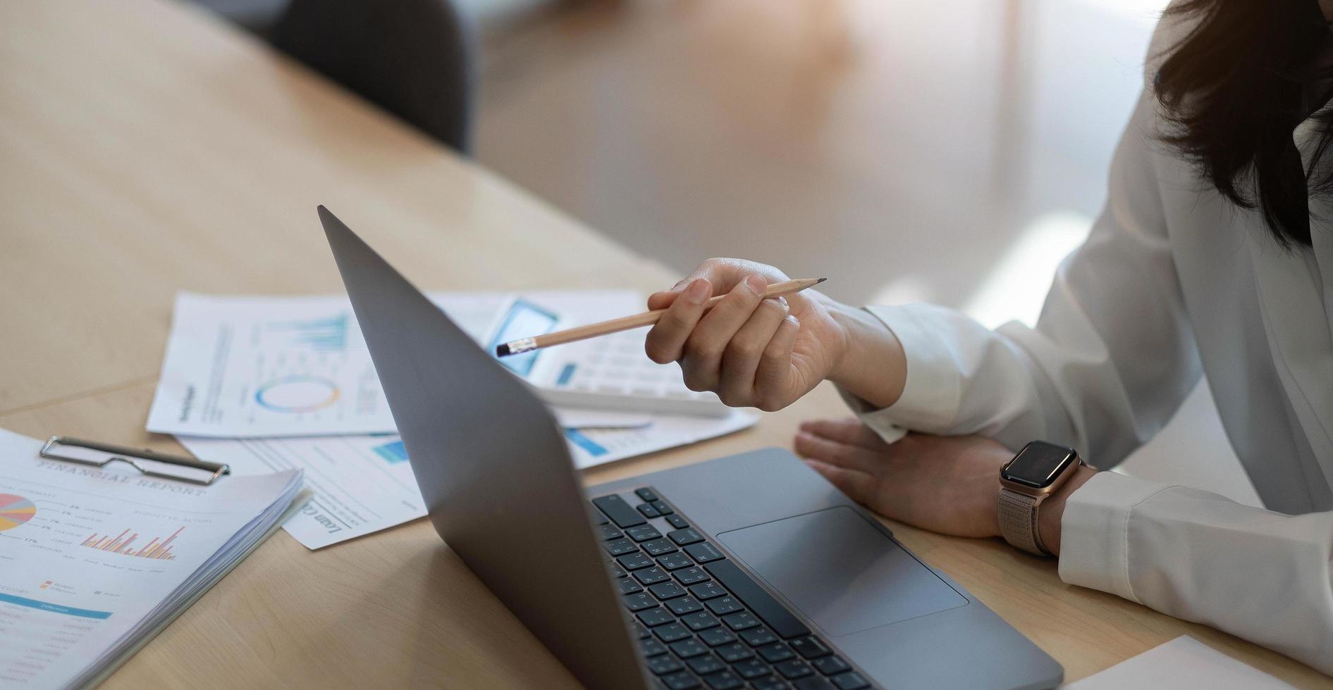Business woman using laptop photo