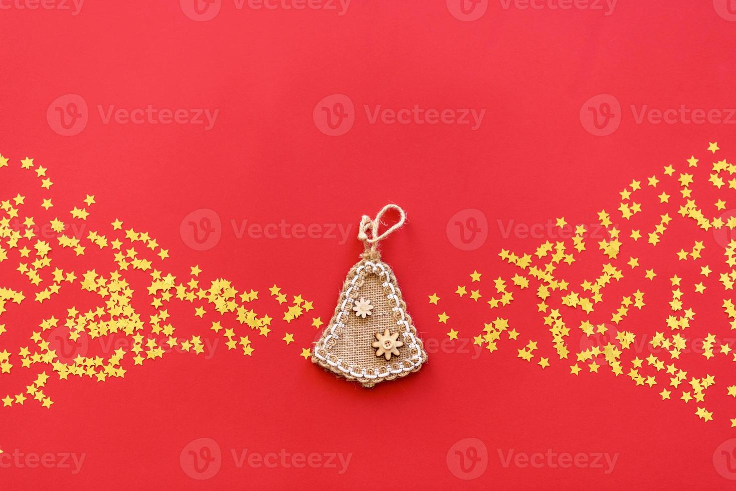 Christmas red decorations, fir tree branches on red background photo