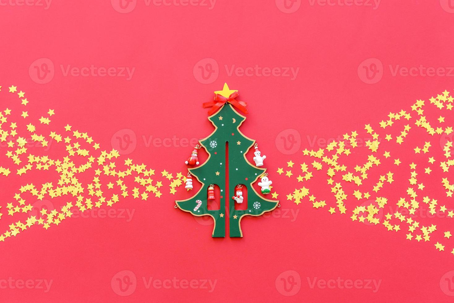 Christmas red decorations, fir tree branches on red background photo