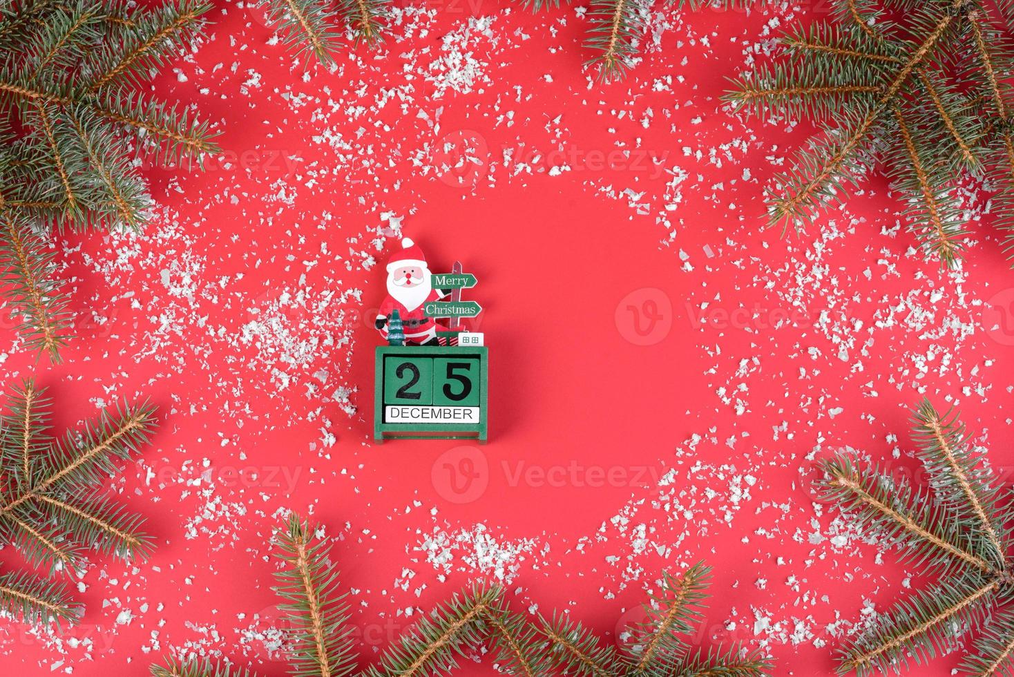 Christmas red decorations, fir tree branches on red background photo