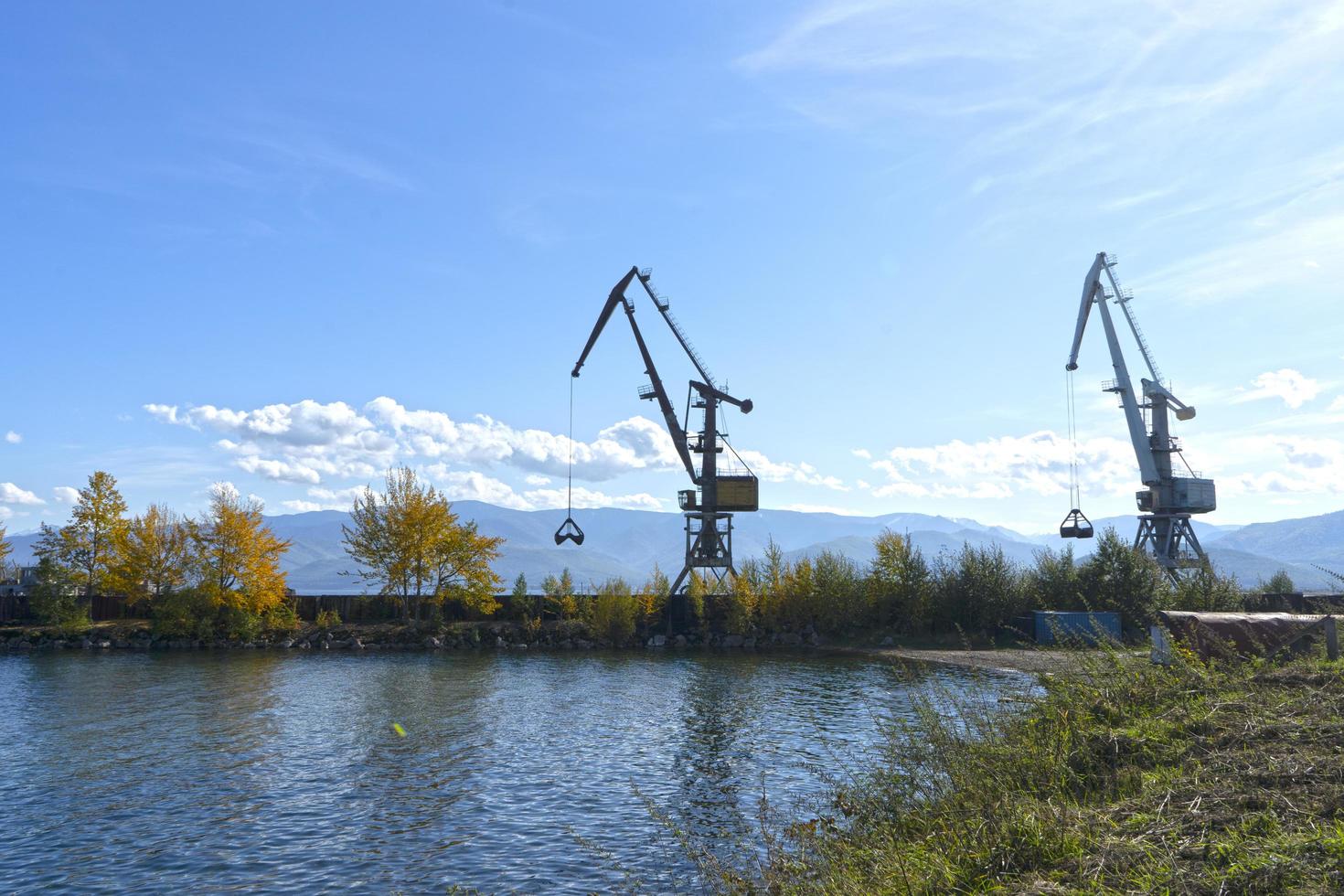 Landscape with a view of Lake Baikal and cranes on the shore photo