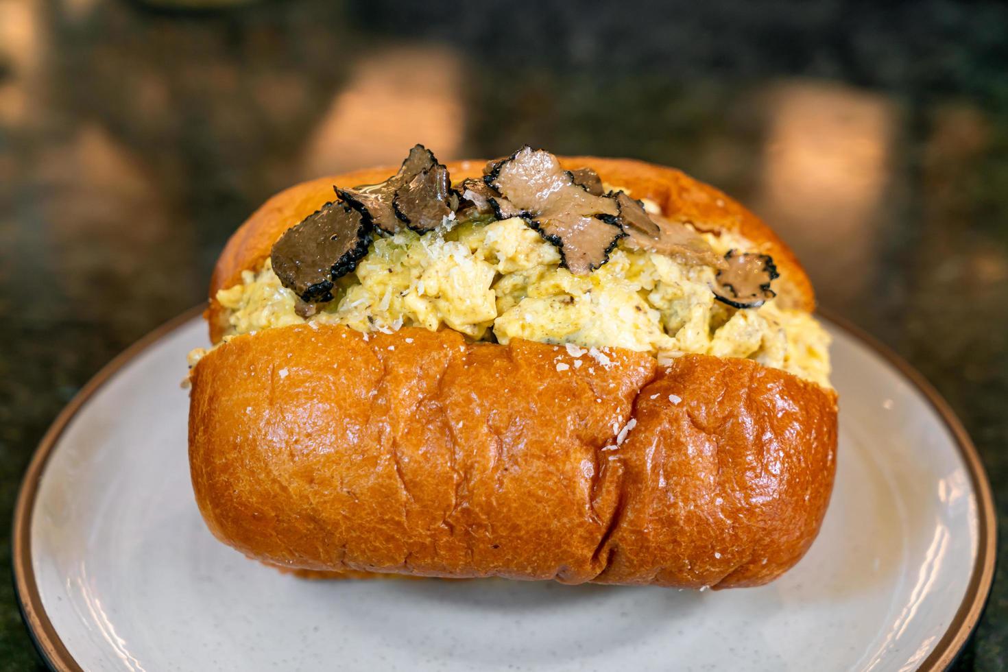 Bun or bread with scrambled eggs and truffle mushroom photo