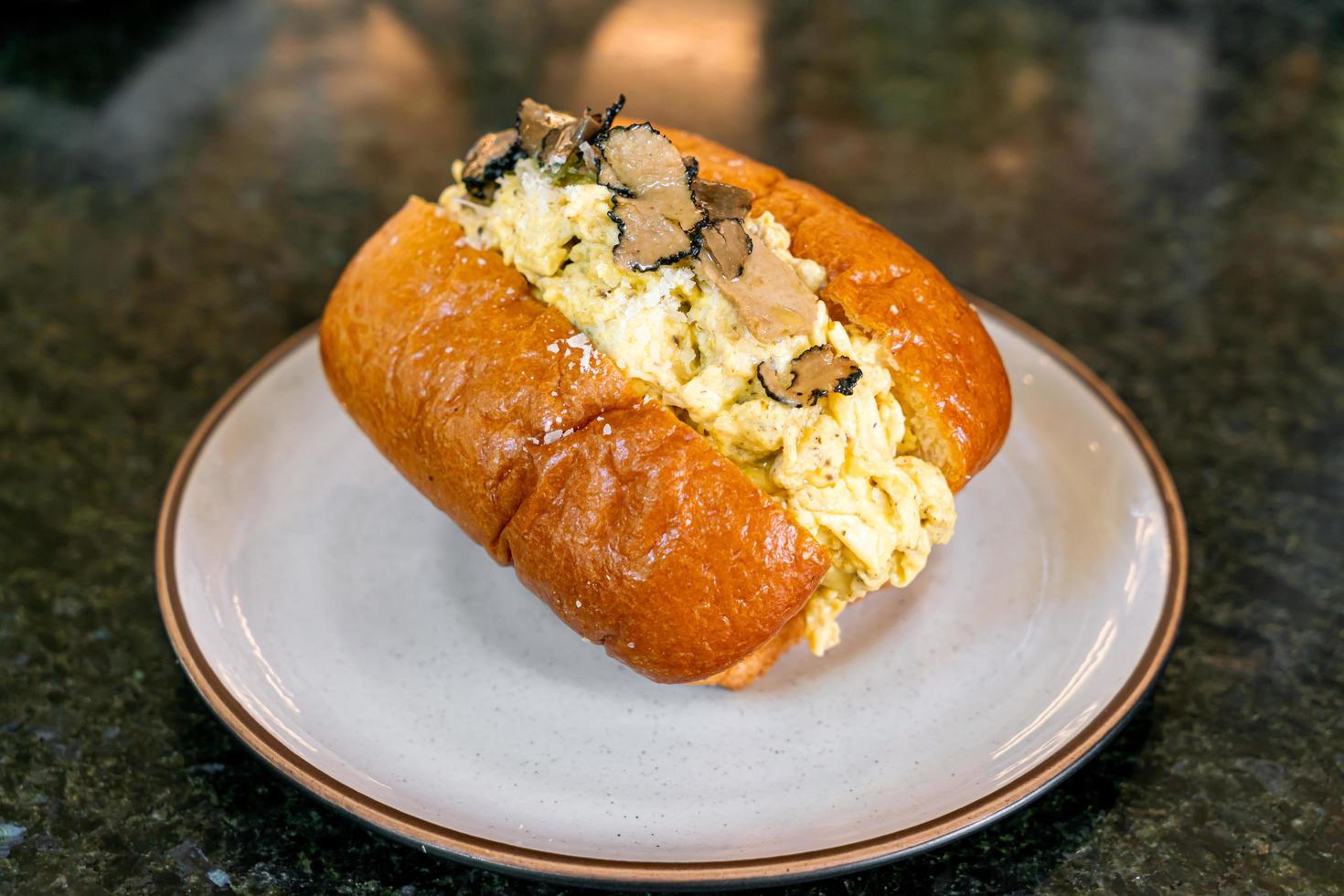 Bun or bread with scrambled eggs and truffle mushroom photo