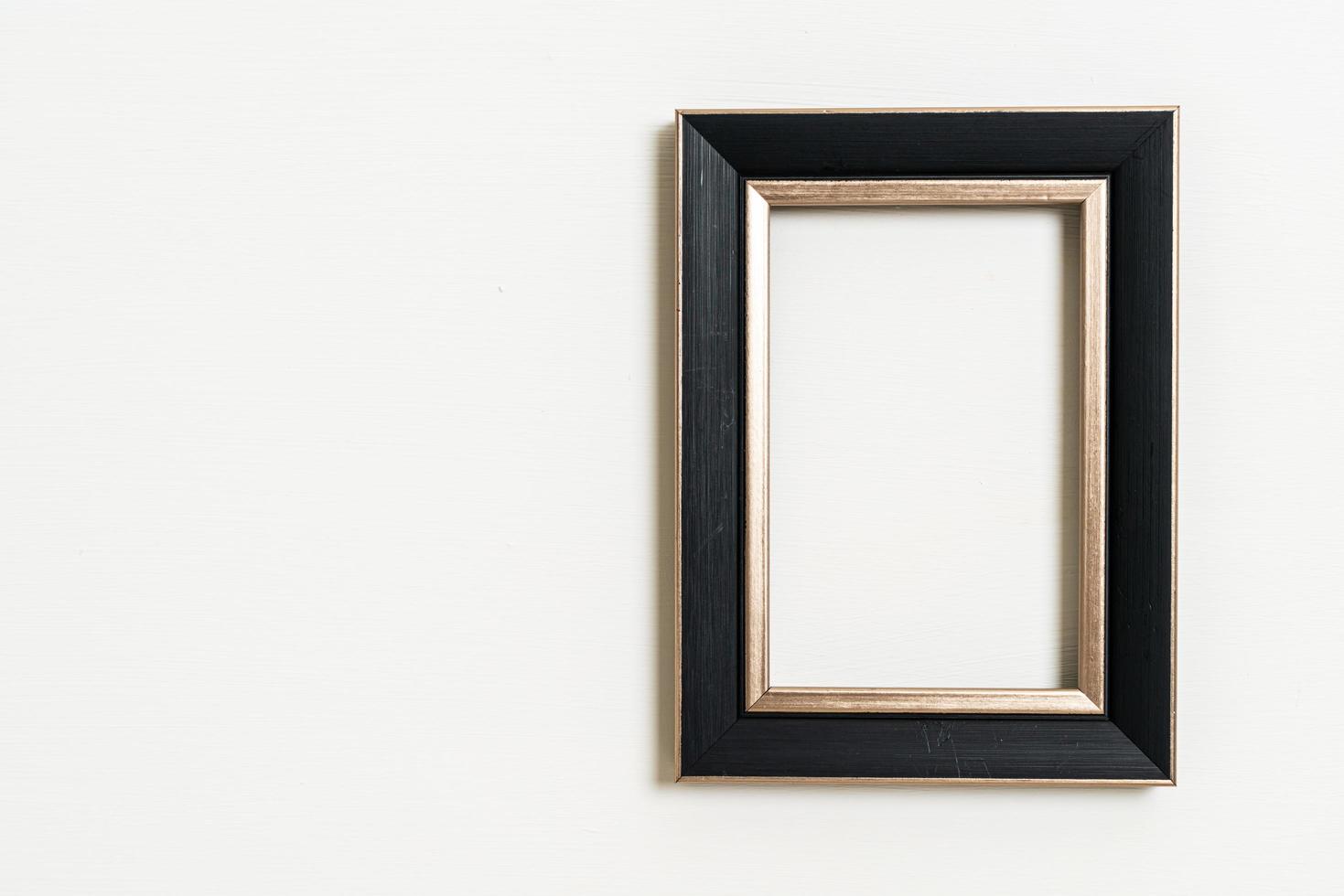 Empty picture frame on white wall background with copy space photo
