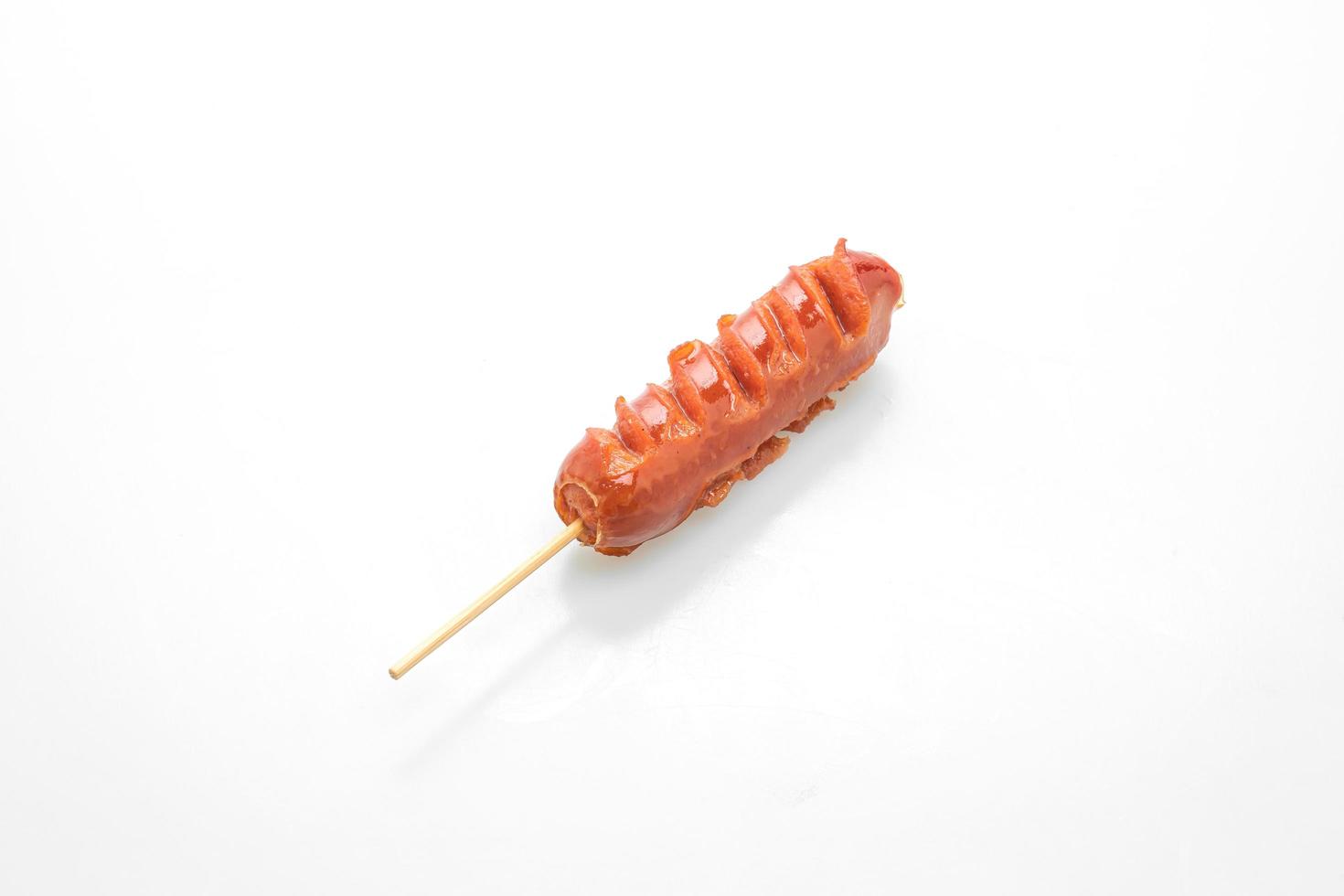 Fried sausage skewer isolated on white background photo