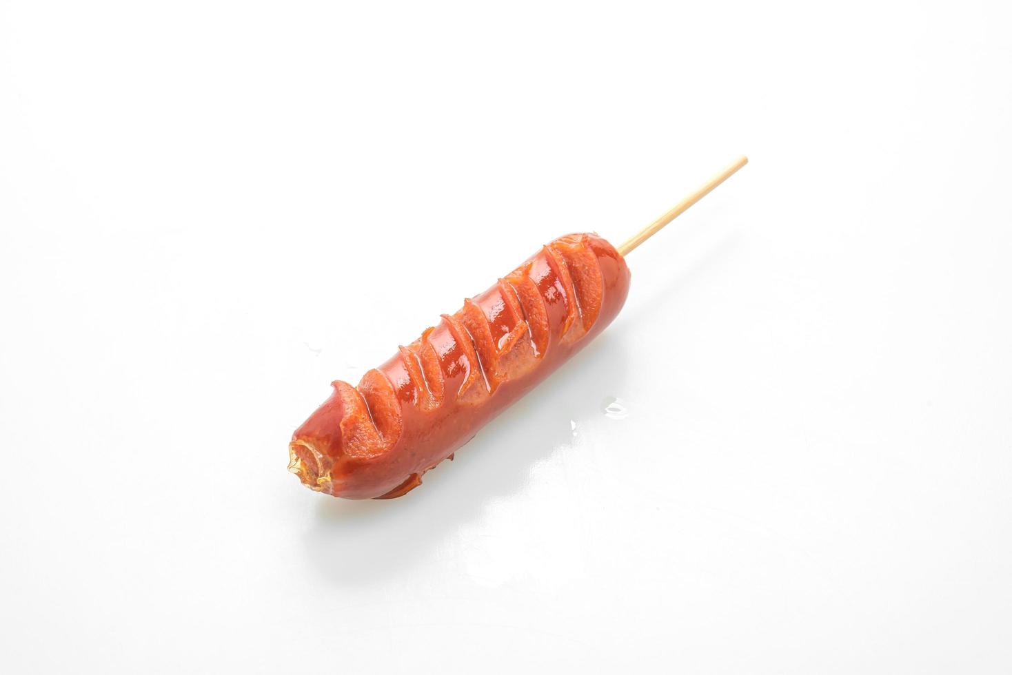 Fried sausage skewer isolated on white background photo