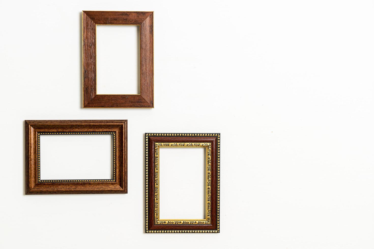 Empty picture frame on white wall background with copy space photo