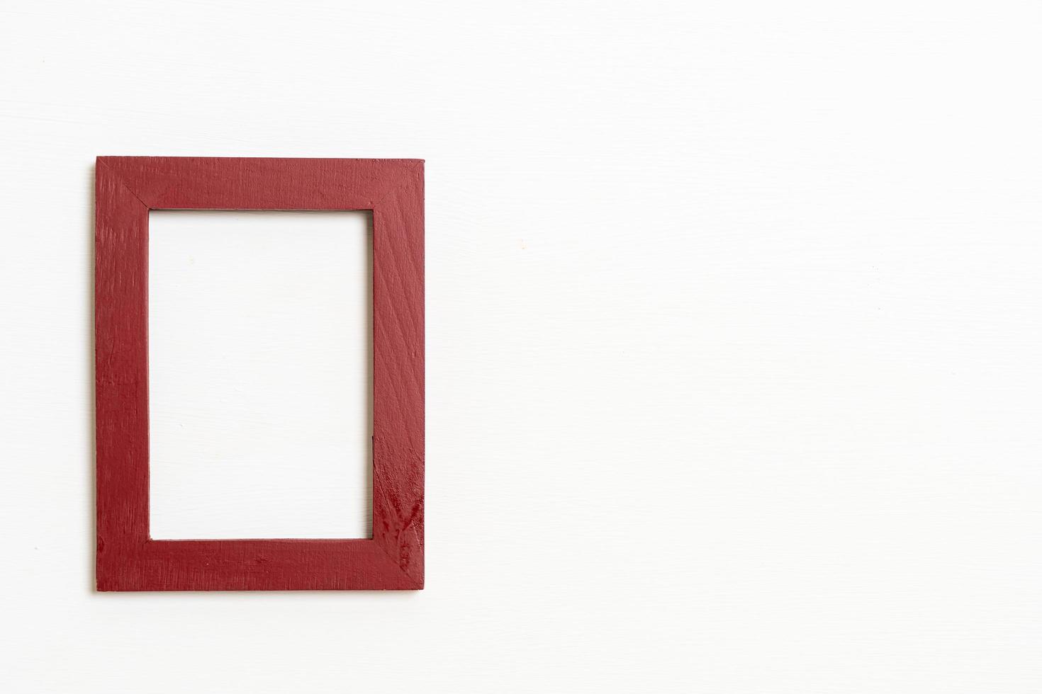 Empty picture frame on white wall background with copy space photo