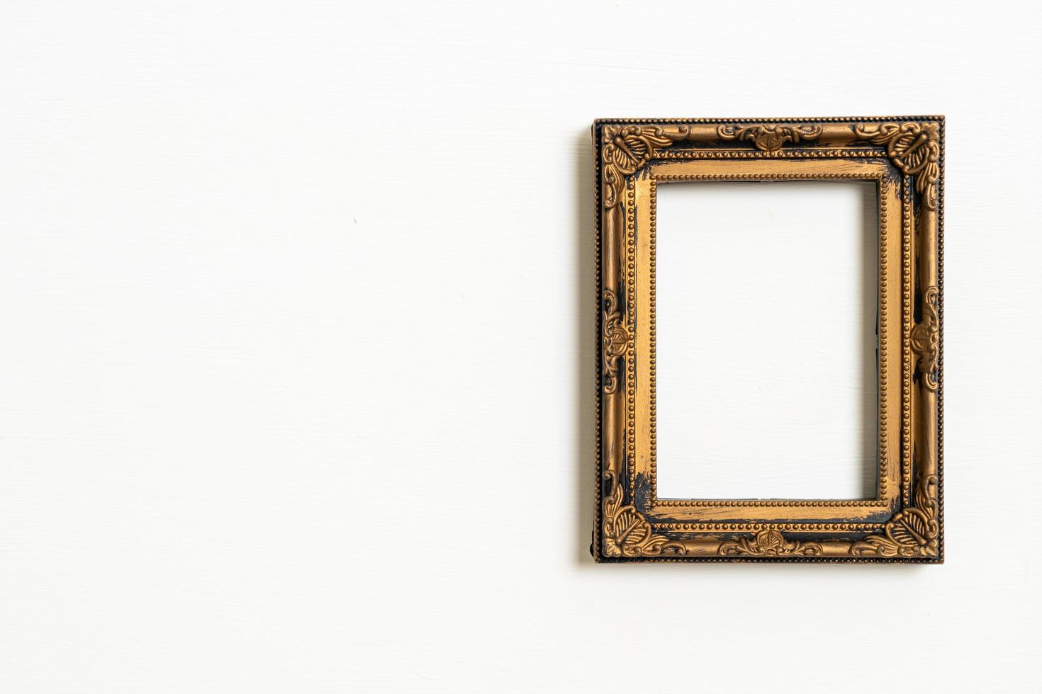 Empty picture frame on white wall background with copy space photo