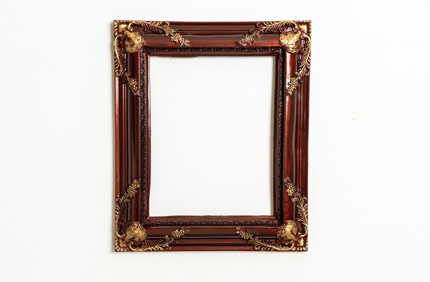 Empty picture frame on white wall background with copy space photo