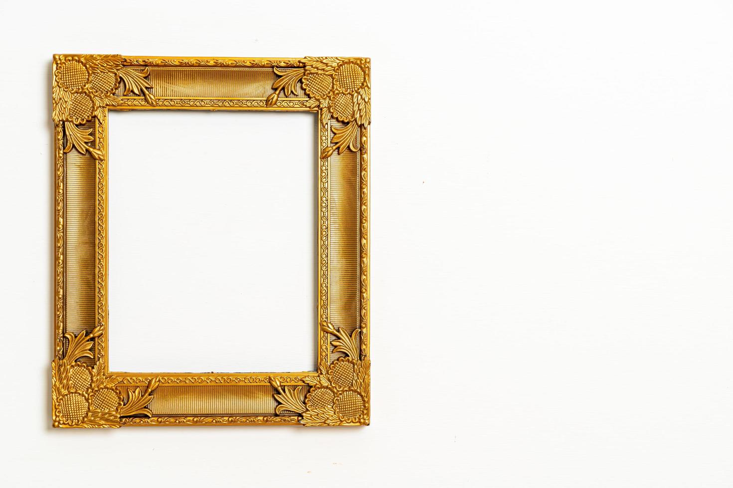 Empty picture frame on white wall background with copy space photo