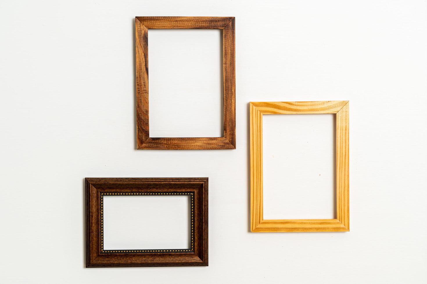 Empty picture frame on white wall background with copy space photo