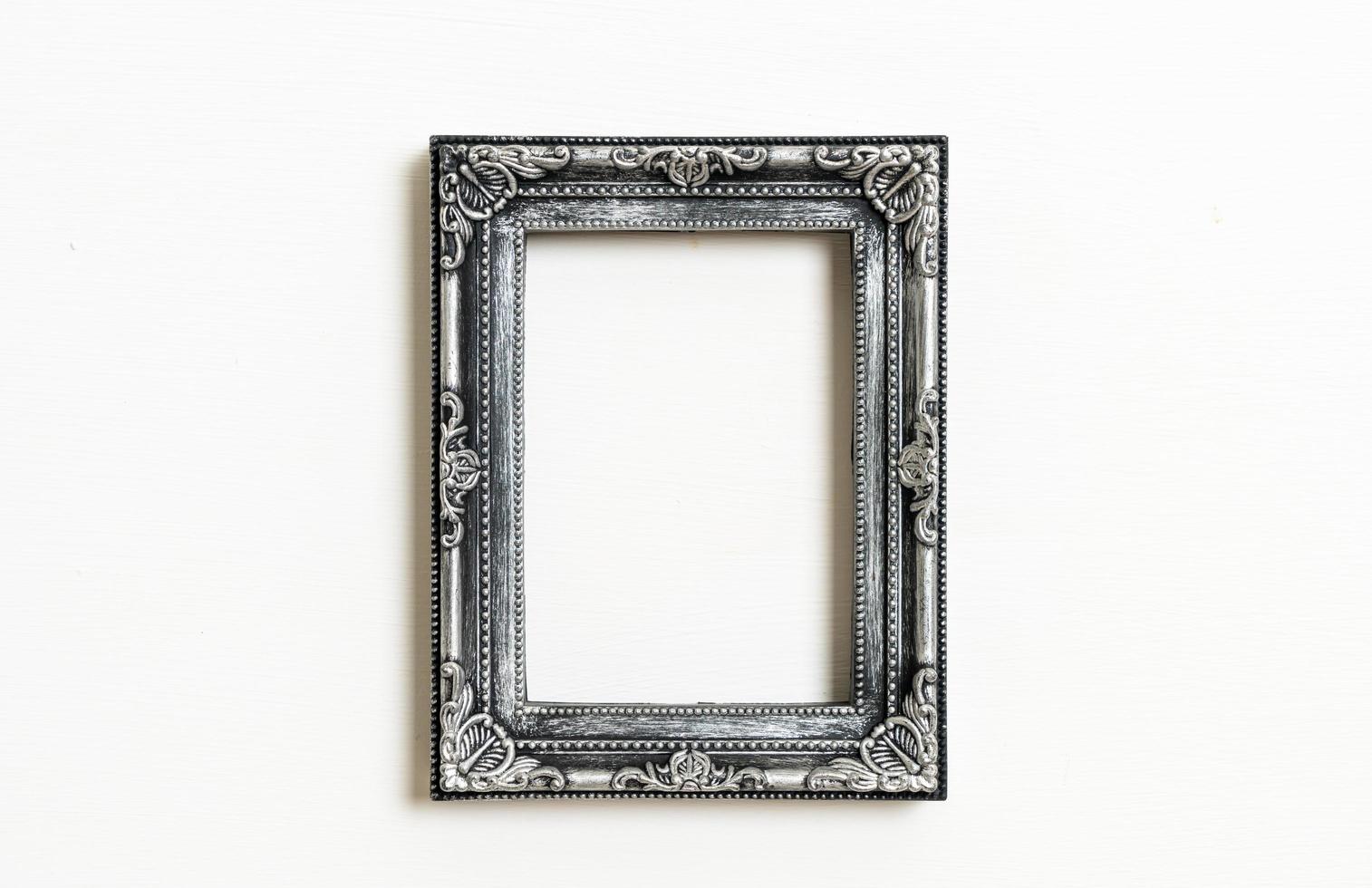 Empty picture frame on white wall background with copy space photo