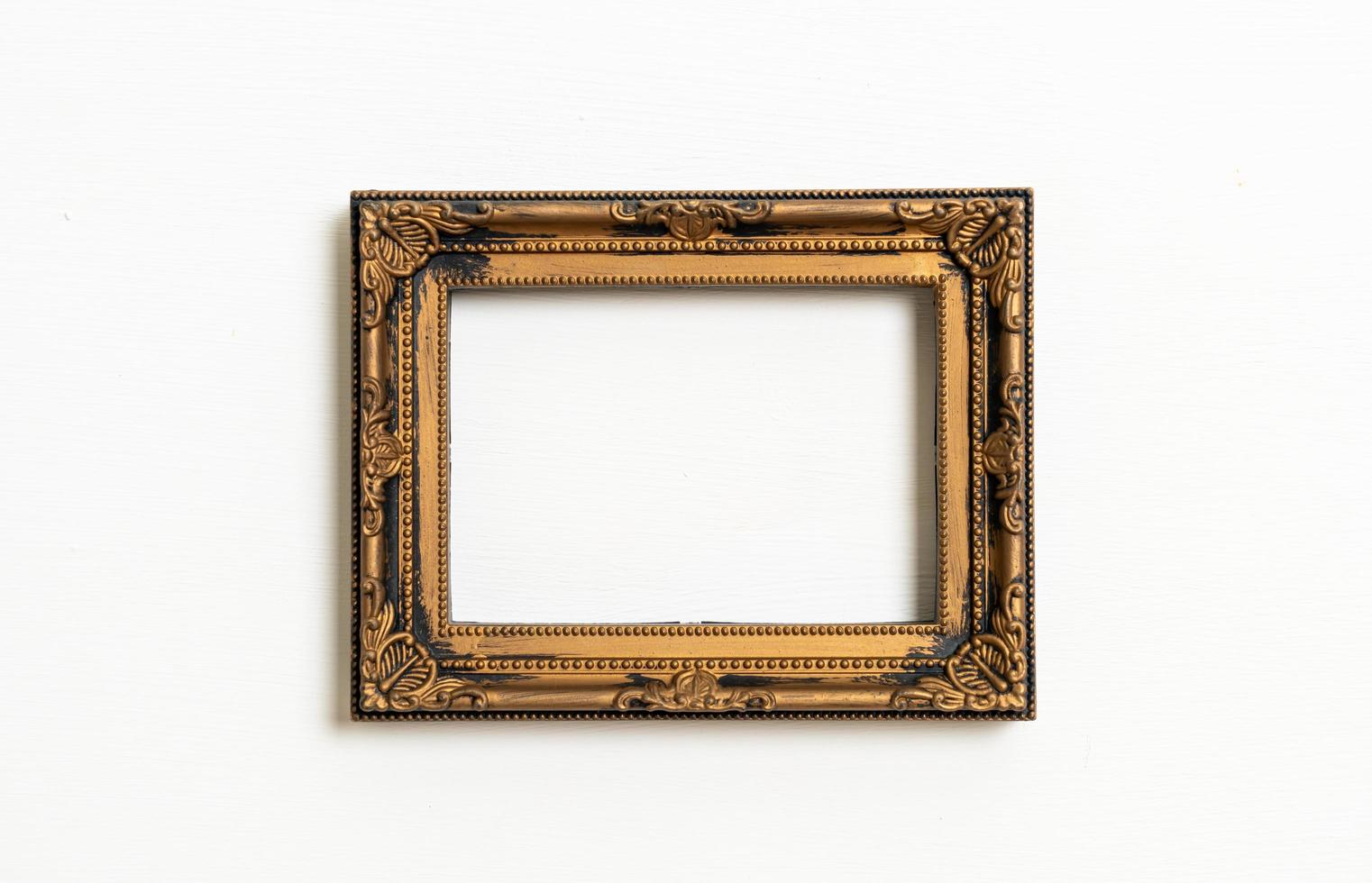 Empty picture frame on white wall background with copy space photo