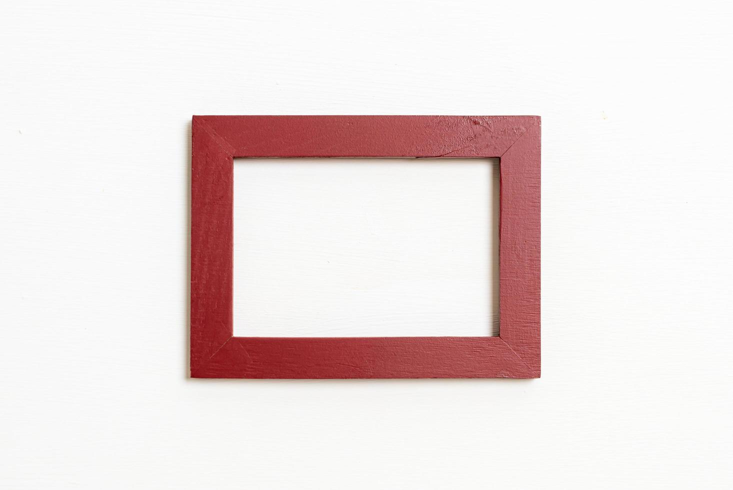 Empty picture frame on white wall background with copy space photo