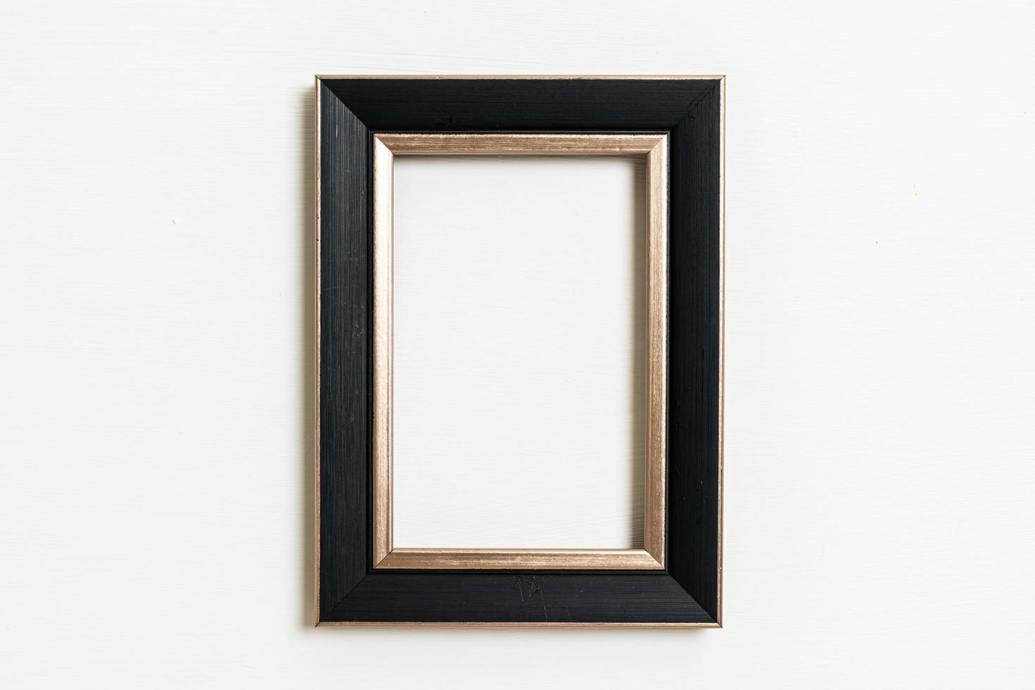 Empty picture frame on white wall background with copy space photo