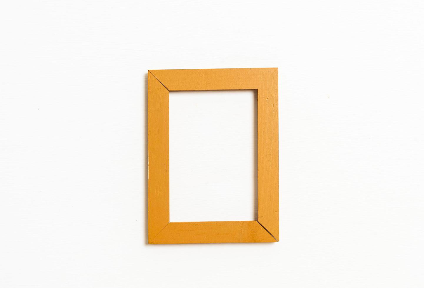 Empty picture frame on white wall background with copy space photo