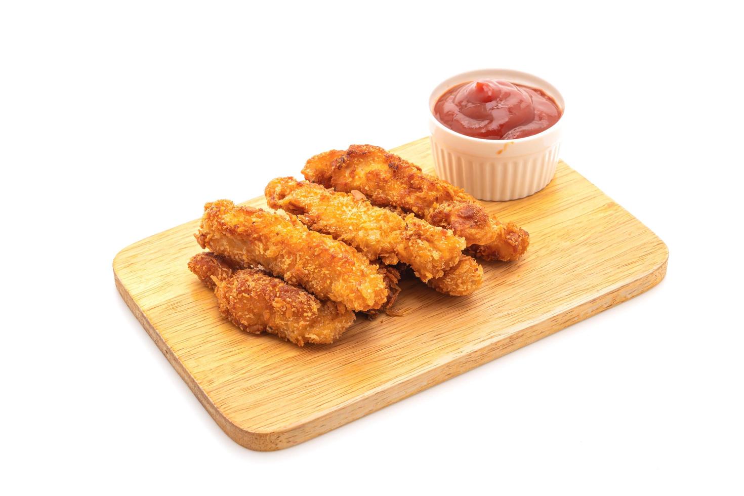 Fried chicken stick with ketchup photo