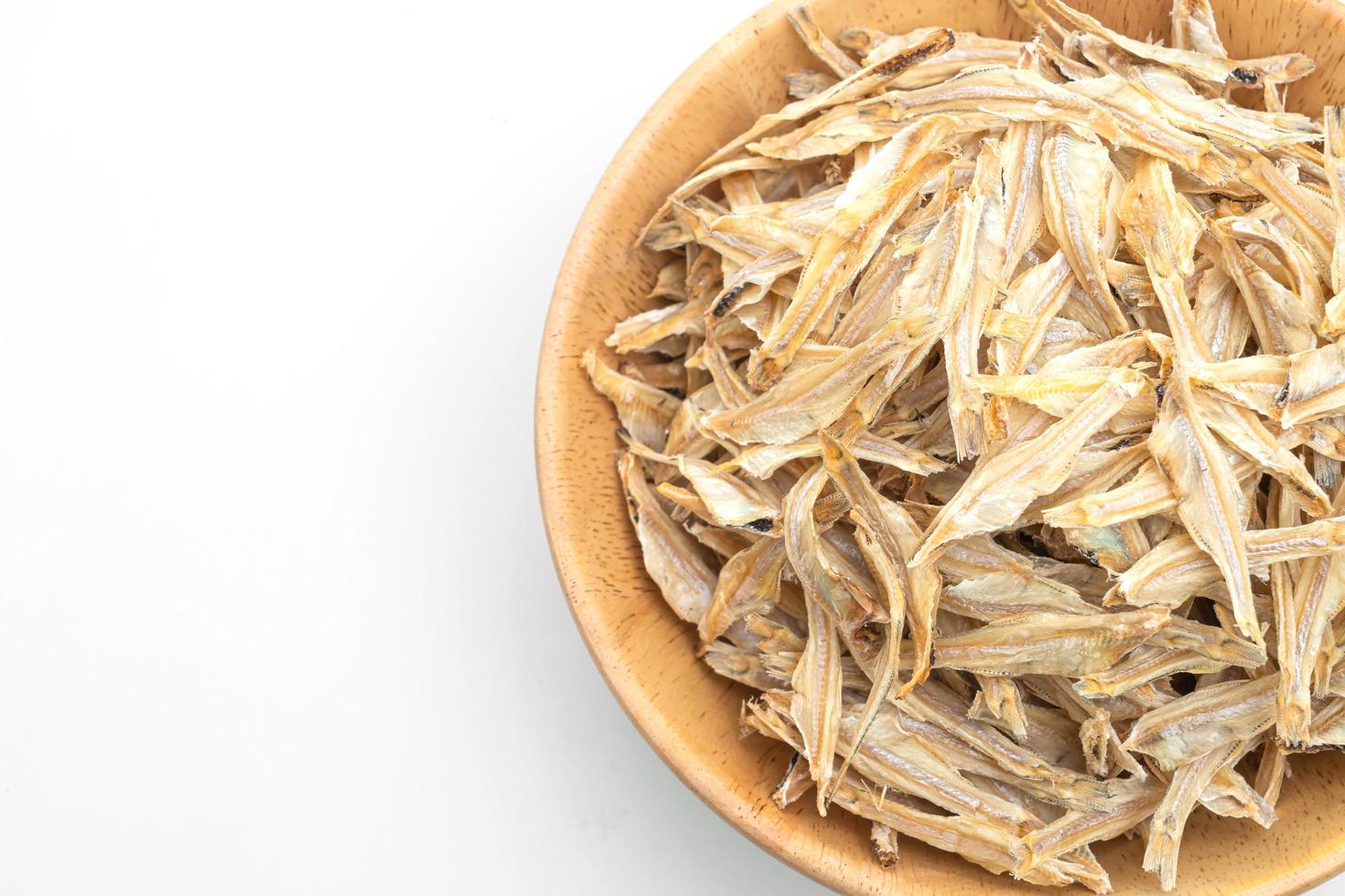 Dried small crispy bake fish isolated on white background photo