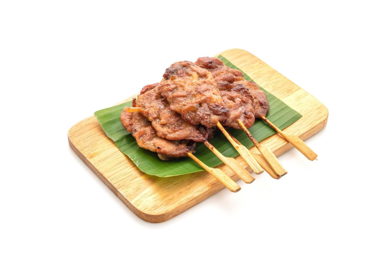 Grilled skewered milk pork with white sticky rice - local Thai street food style photo