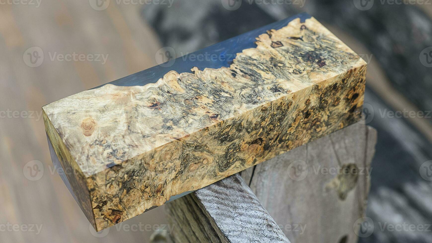 Casting epoxy resin maple burl wood on the table photo