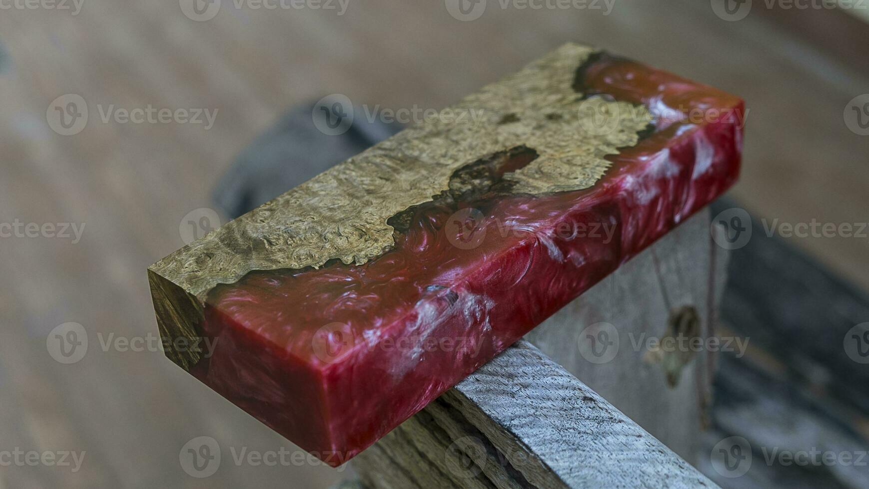 Casting epoxy resin maple burl wood on the table photo