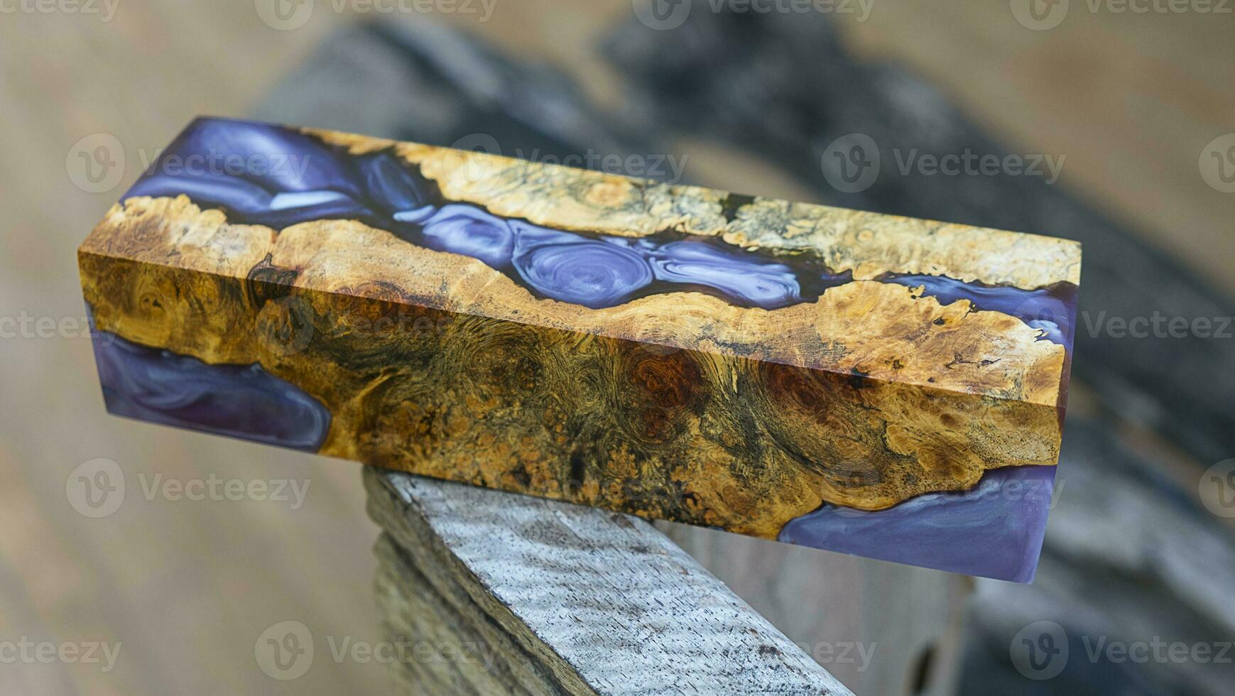 Casting epoxy resin maple burl wood on the table photo