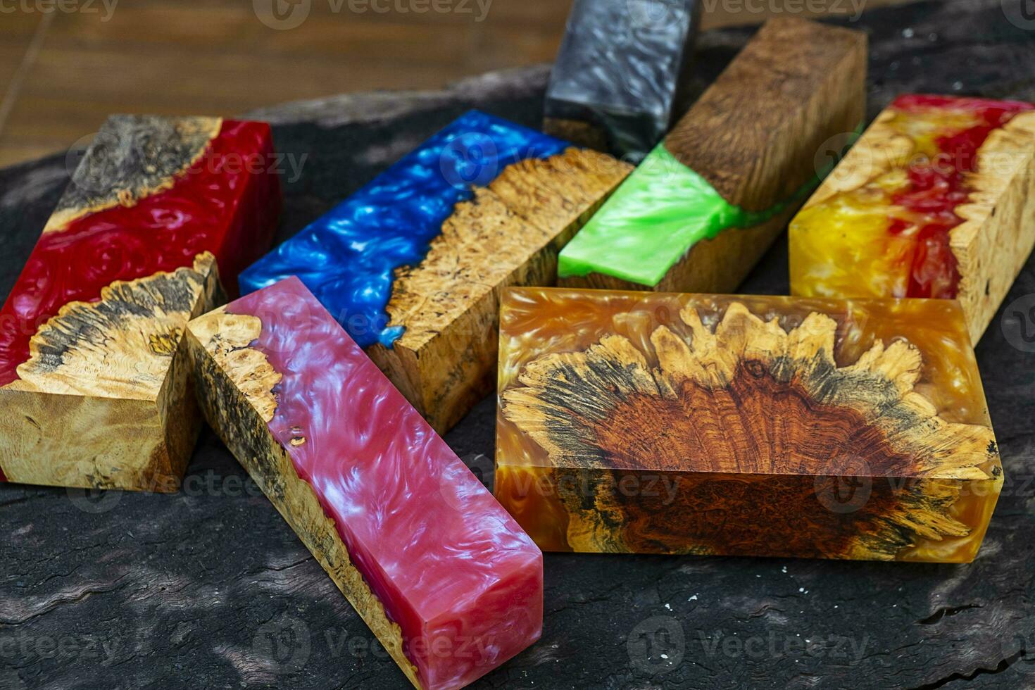 Casting epoxy resin maple burl wood on the table photo