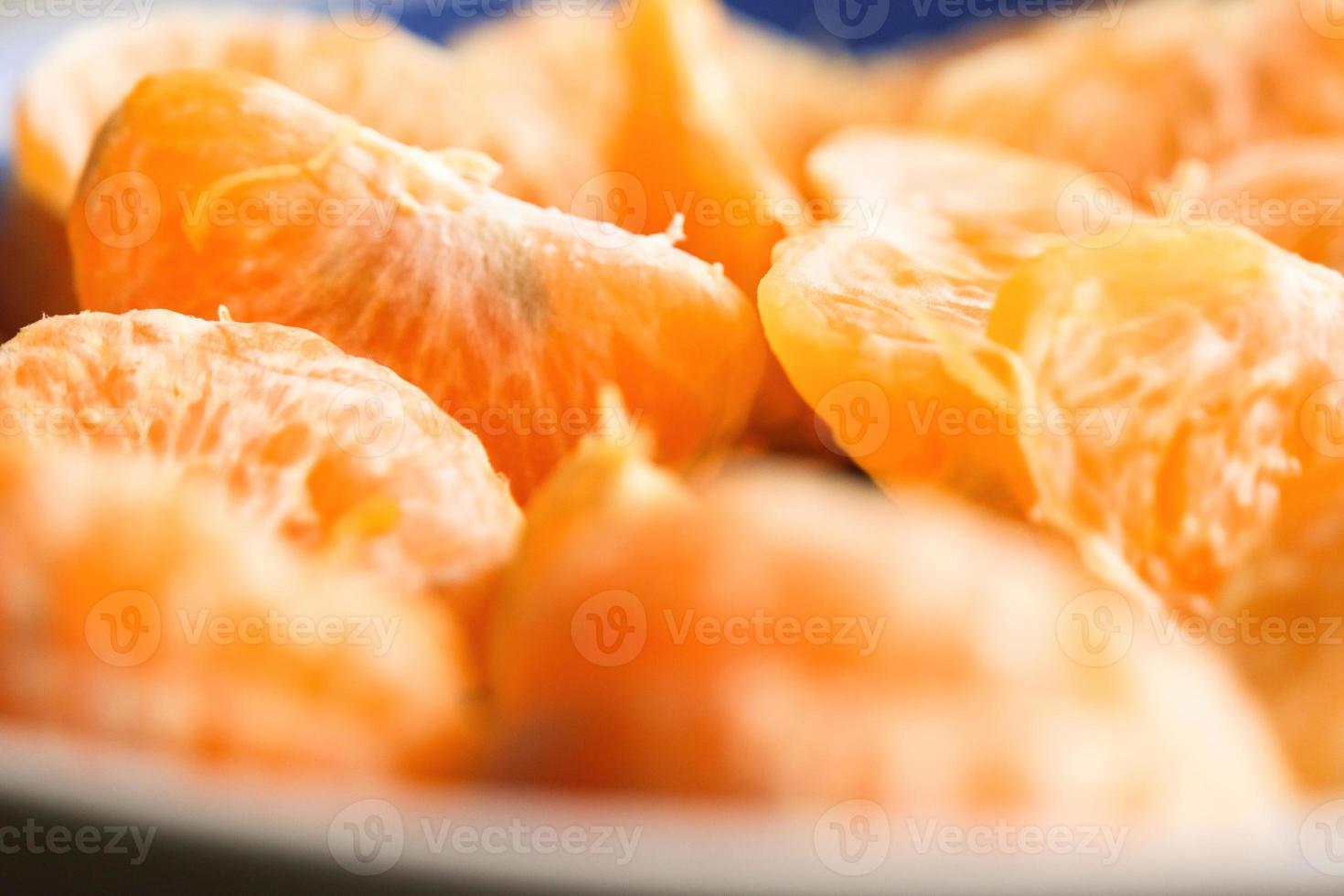 Slices of peeled tangerine photo