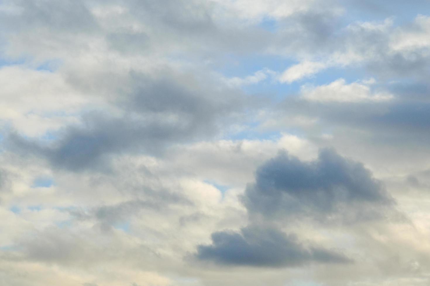 Blue sky with fluffy clouds photo