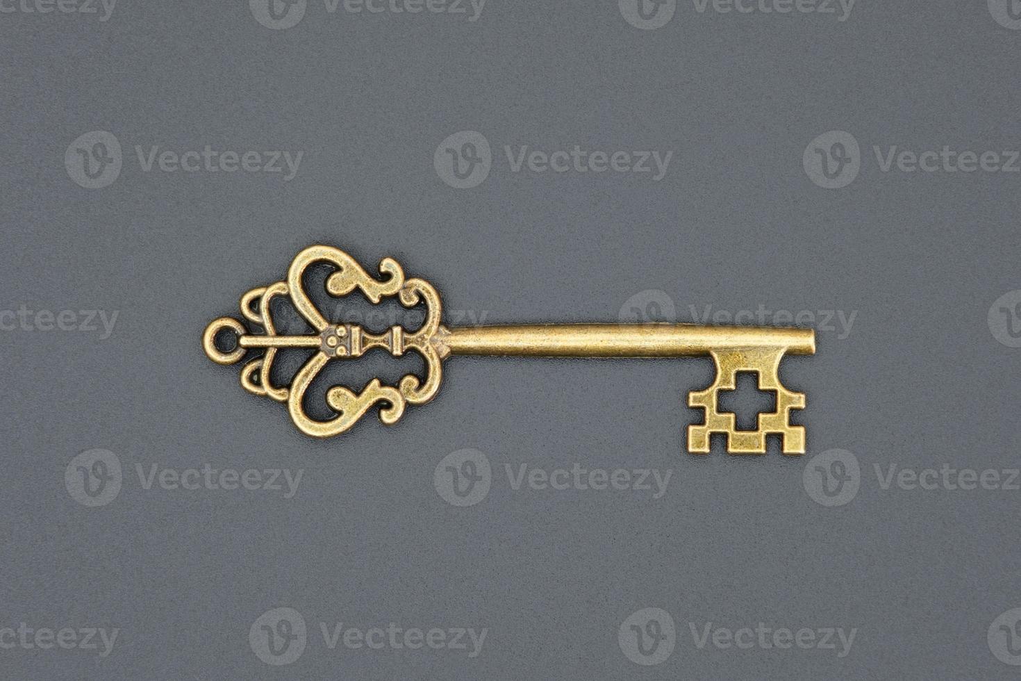 Old ornate key, vintage design element photo