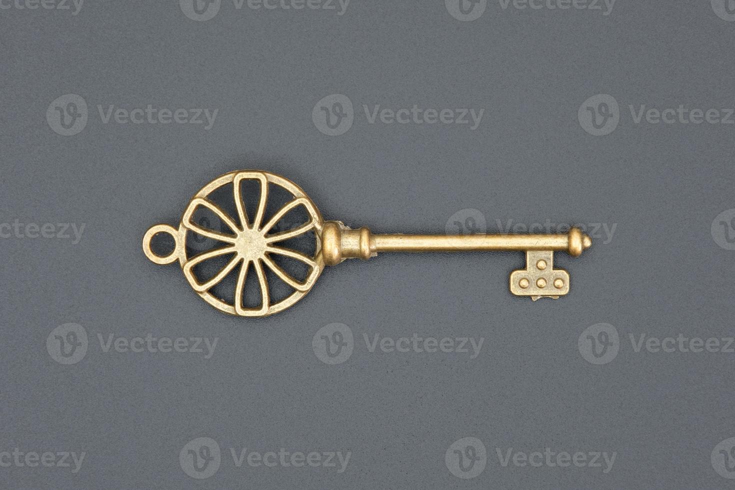 Old ornate key, vintage design element photo