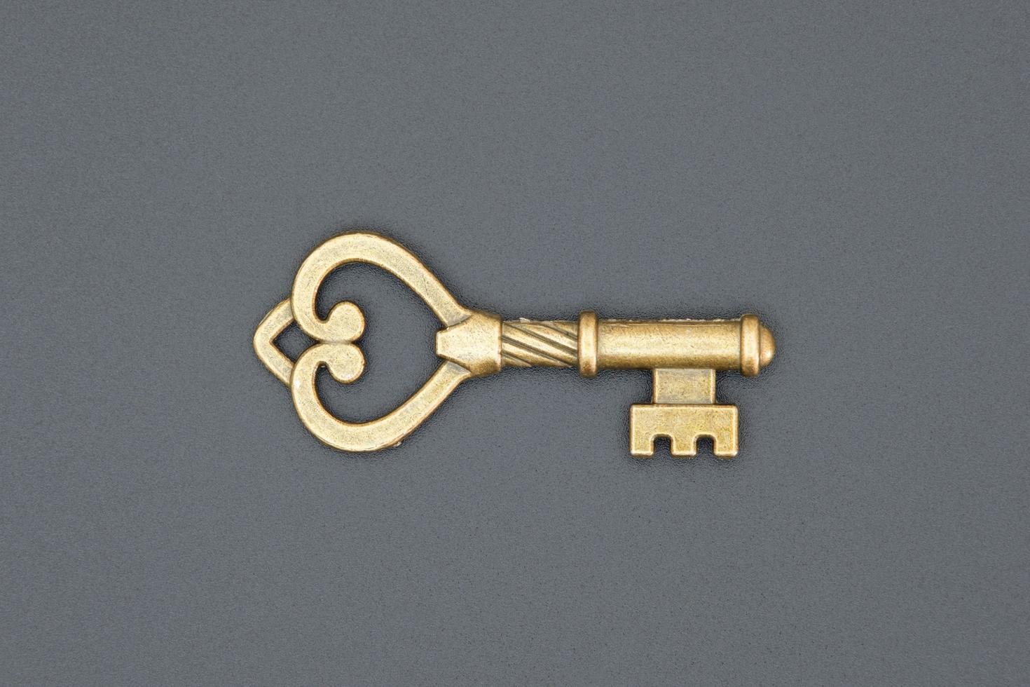 Old ornate key, vintage design element photo
