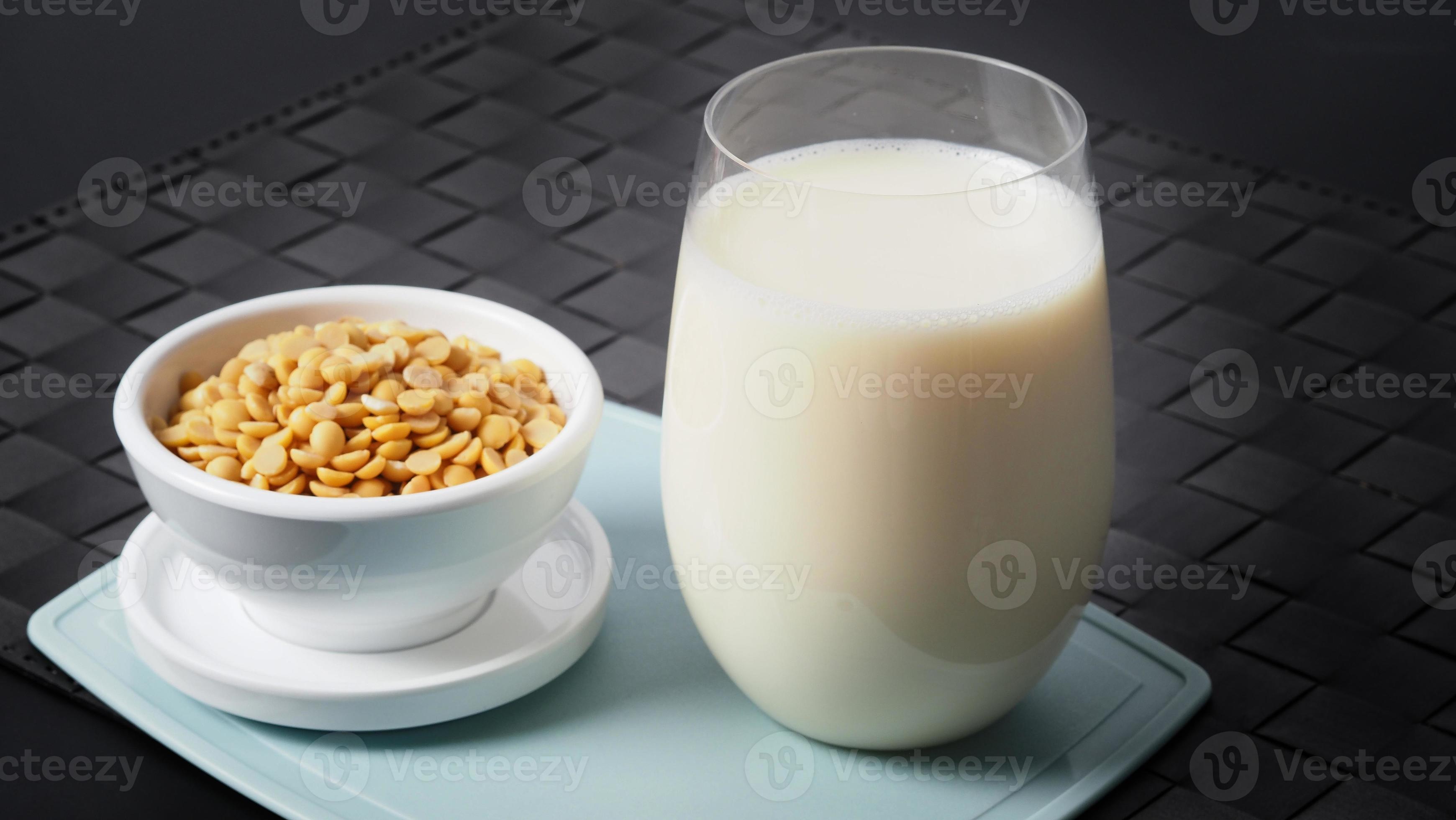 Soy milk with no sugar added in a glass on a green color plastic plate 2986578 Stock Photo at