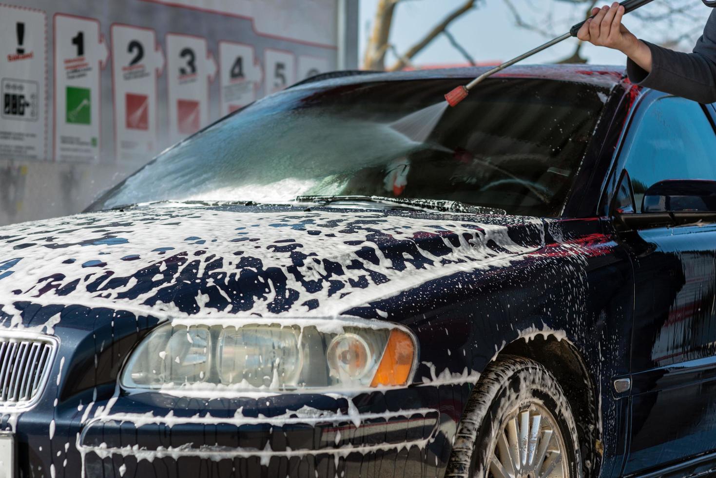 Car without touch washing self-service. Wash with water and foam. photo