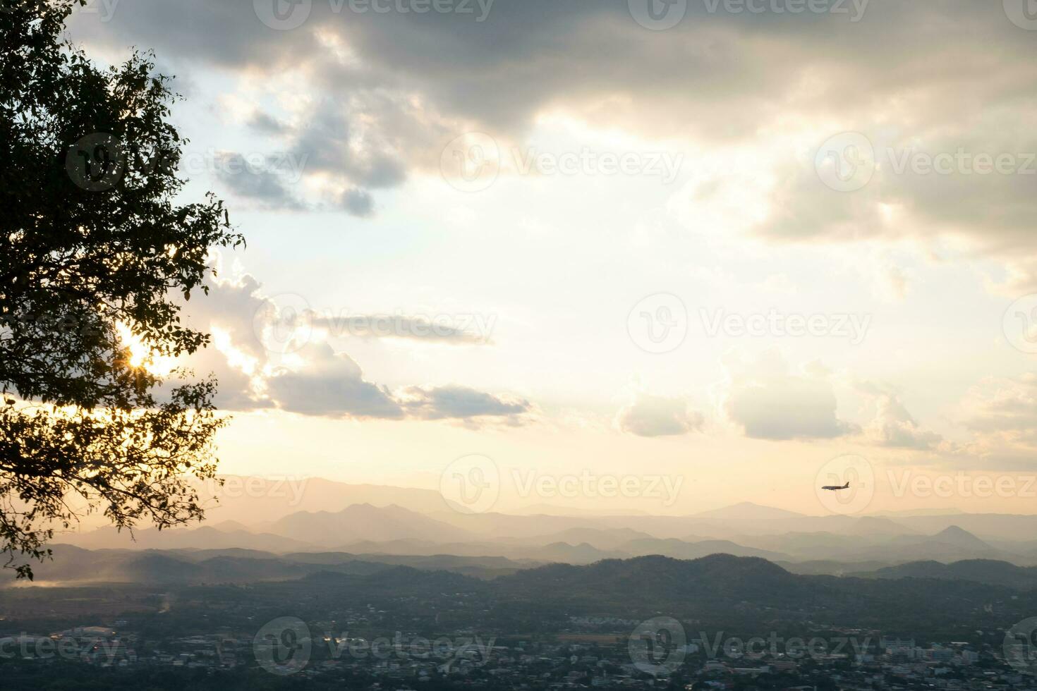 The Sun is falling behind the mountain and city view the beautiful river, Overcast sky cloud, Photo Loei  city Thailand from Phu Bo Bit mountain peak