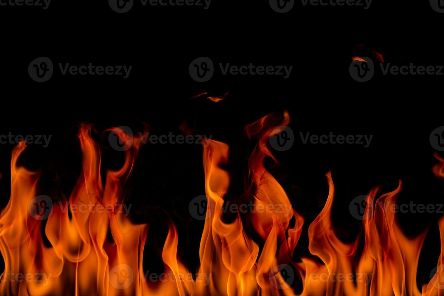 Fire flames with smoke on black background photo