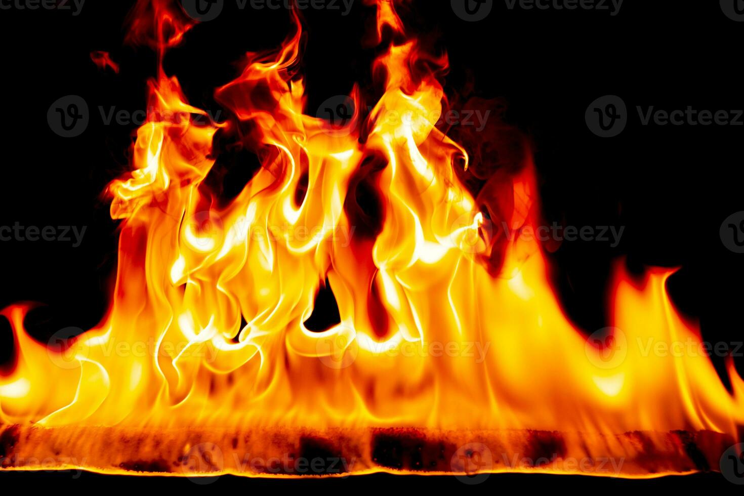 Fire flames with smoke on black background photo