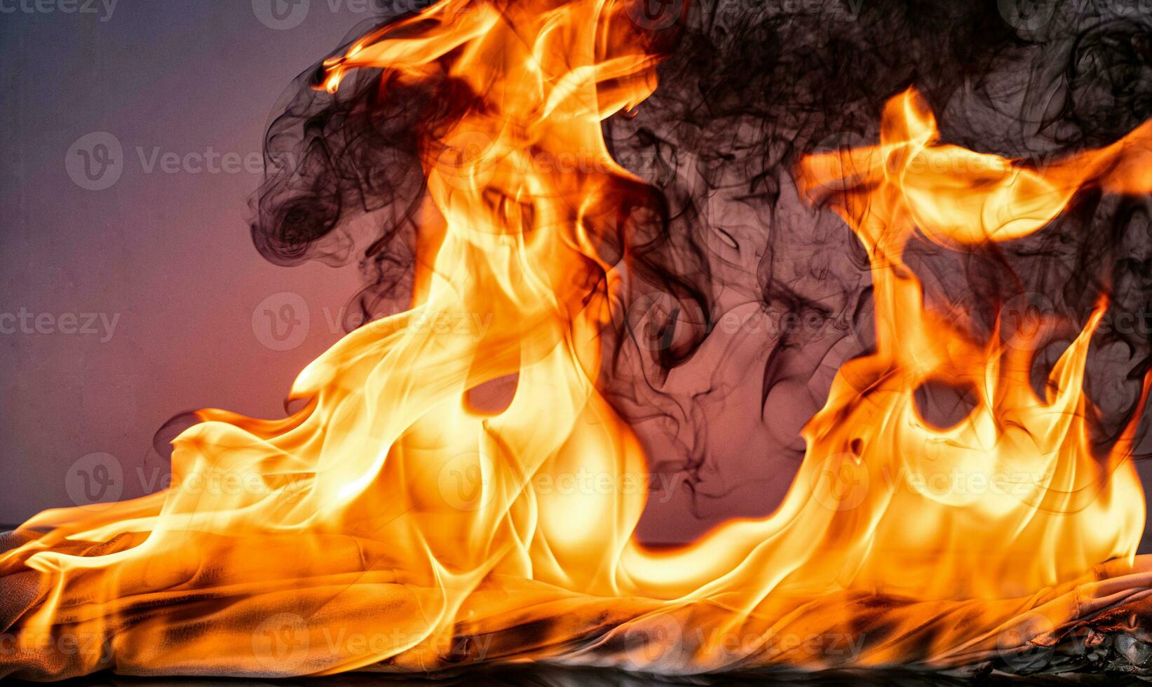 Fire flames with smoke on black background photo