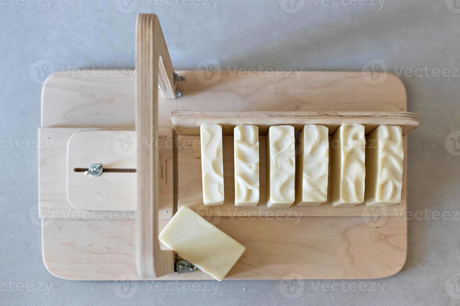 Handmade natural baby soap.Ready-made soap, cut into pieces on a special machine. Home spa. Small business photo