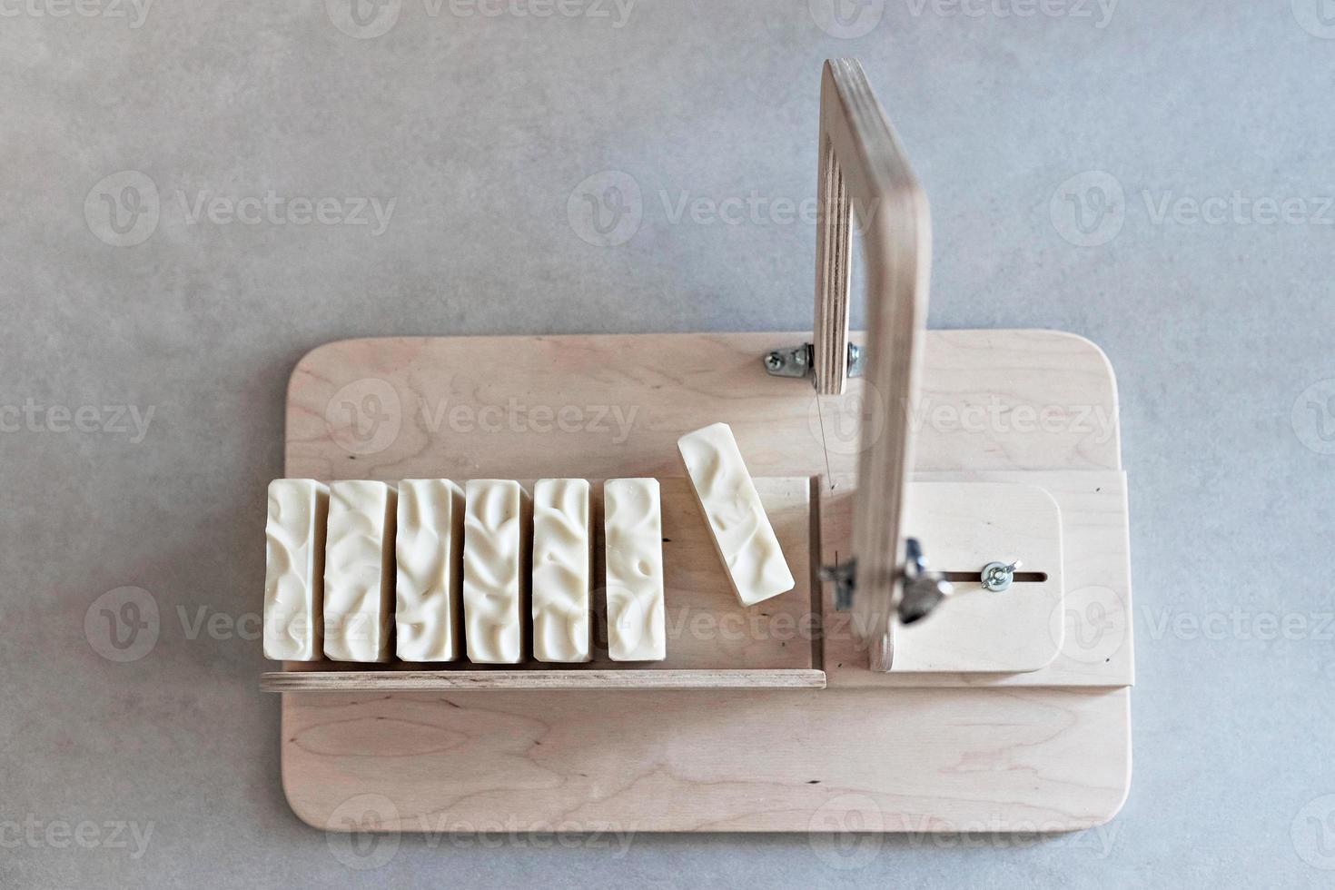 Handmade natural baby soap.Ready-made soap, cut into pieces on a special machine. Home spa. Small business photo