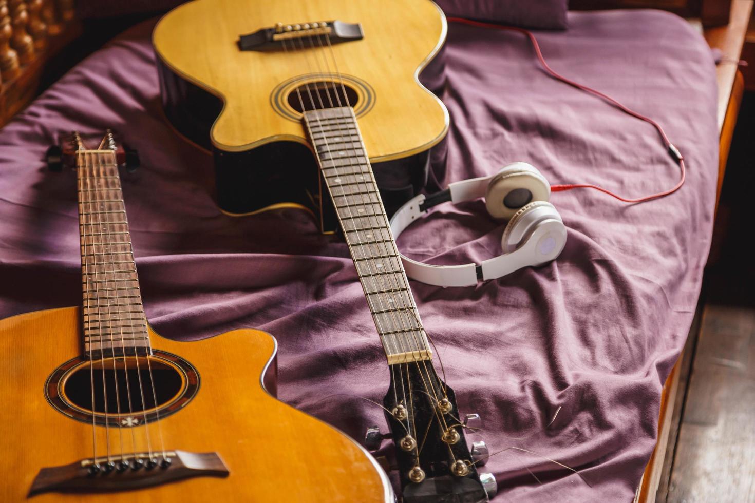 Two classic guitar in bed photo