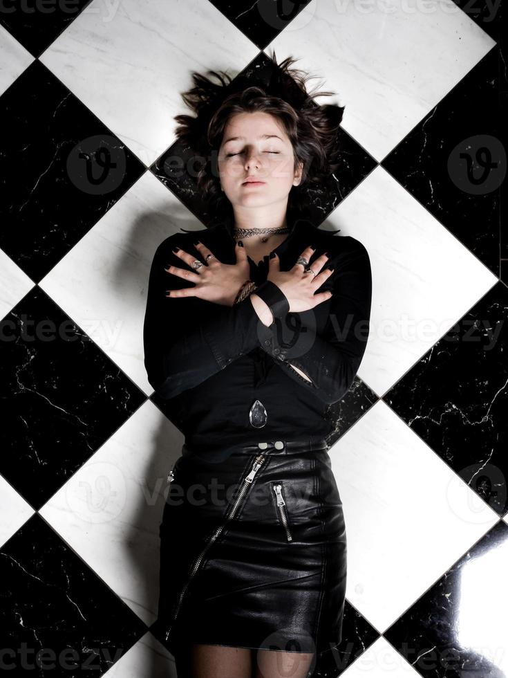 A young girl in leather clothes photo