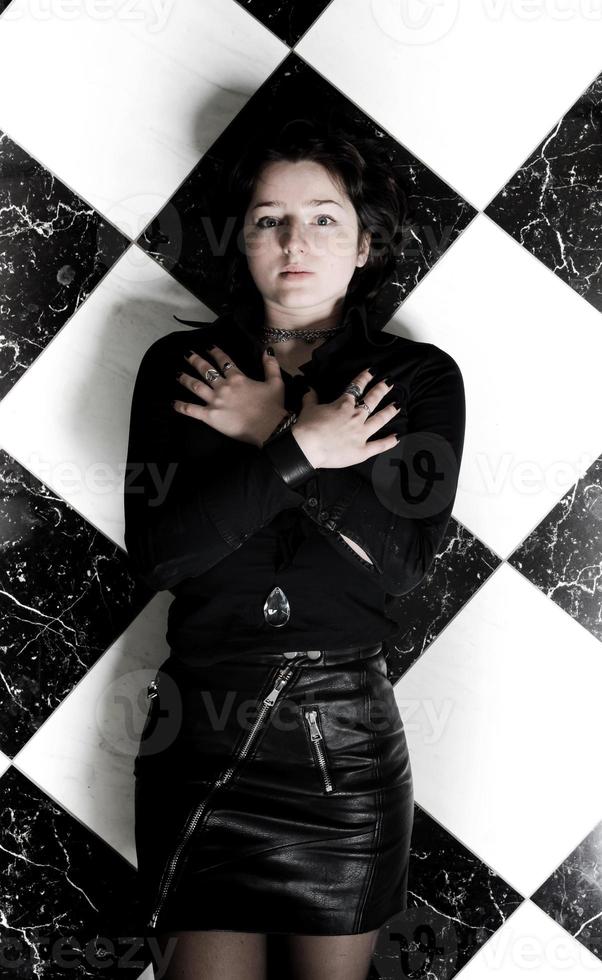 A young girl in leather clothes photo