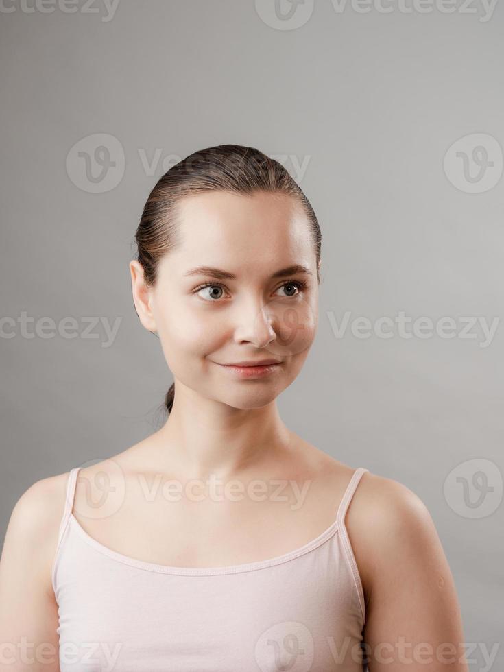 Beautiful Young Woman with Clean Fresh Skin photo