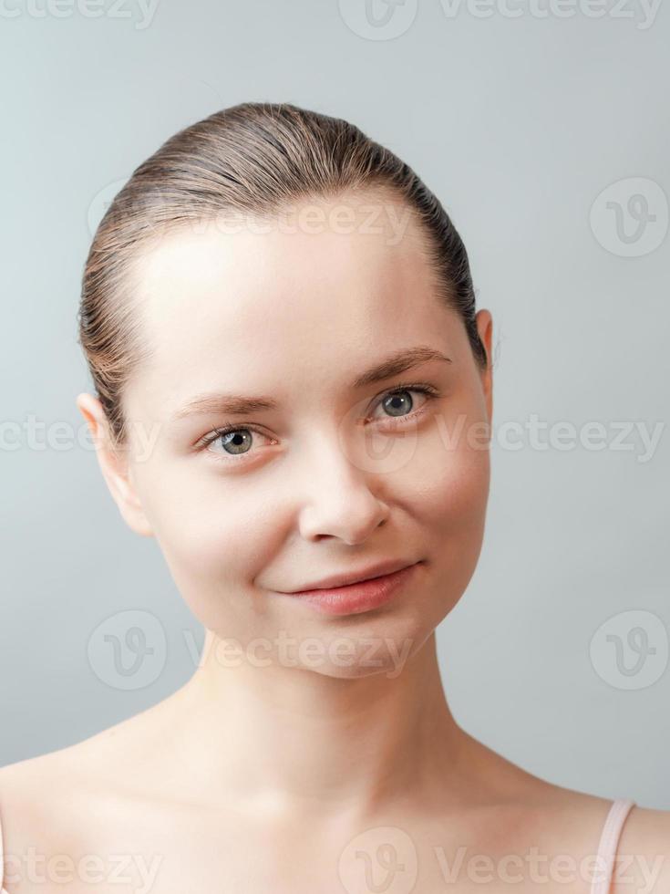 Beautiful Young Woman with Clean Fresh Skin photo