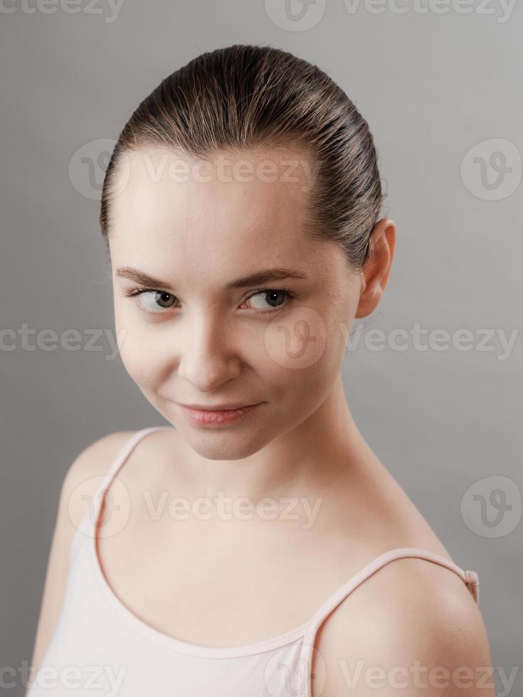 Beautiful Young Woman with Clean Fresh Skin photo